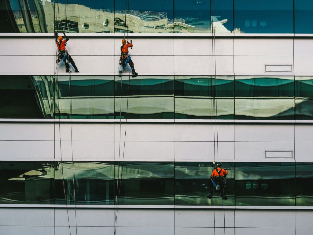 Blackout Projects technicians cleaning post construction high-rise windows
